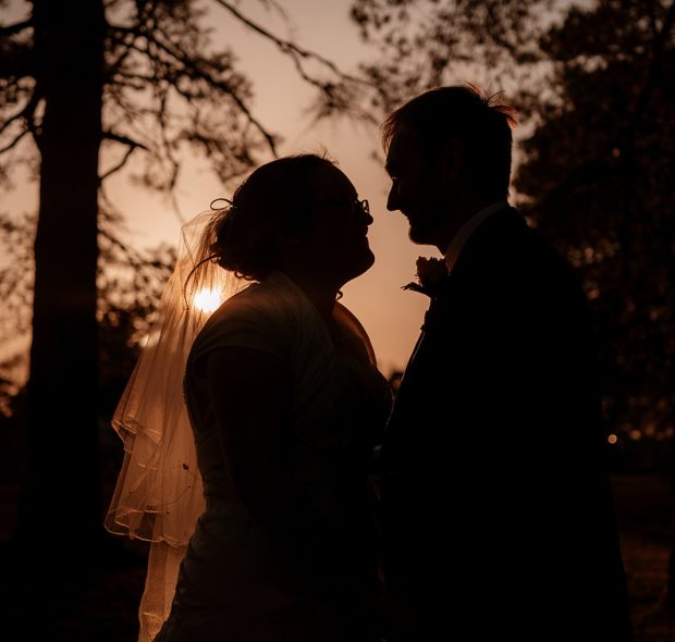 Bride and Groom face to face at sunset