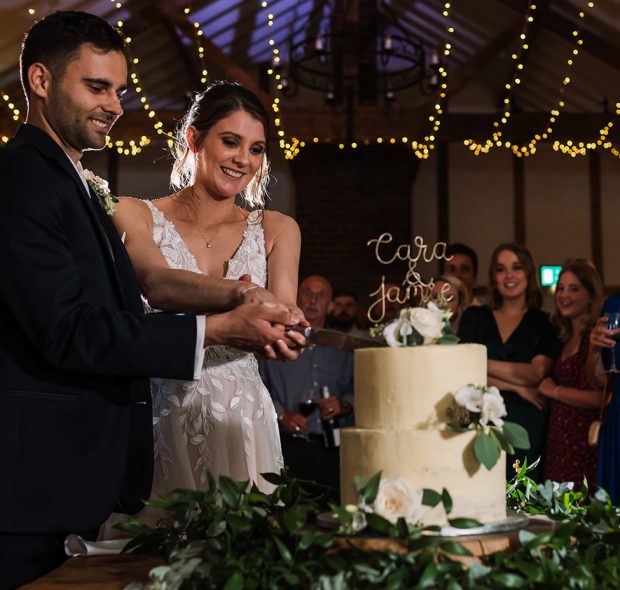 cutting wedding cake
