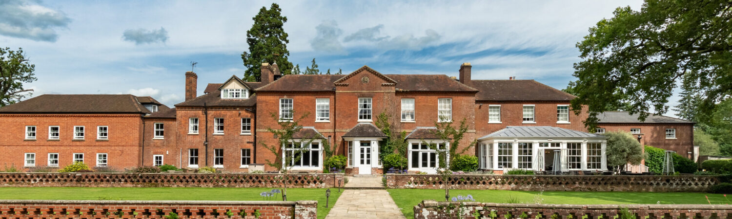 Bartley Lodge Hotel exterior surrounded by the beautiful New Forest