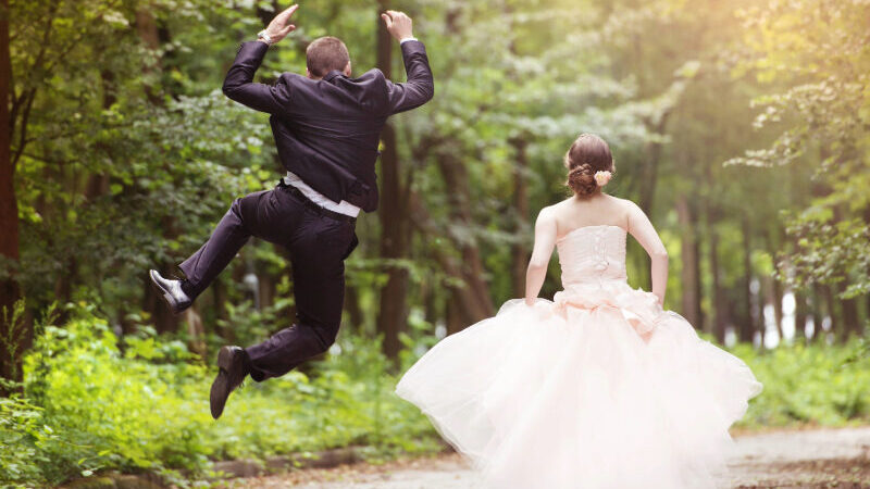 Happy couple celebrating their wedding in a romantic New Forest venue, surrounded by trees, wildflowers, and the natural beauty of the countryside—perfect for nature-inspired ceremonies and outdoor celebration