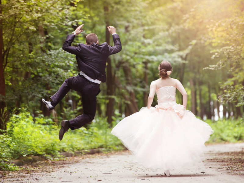 Happy couple celebrating their wedding in a romantic New Forest venue, surrounded by trees, wildflowers, and the natural beauty of the countryside—perfect for nature-inspired ceremonies and outdoor celebration