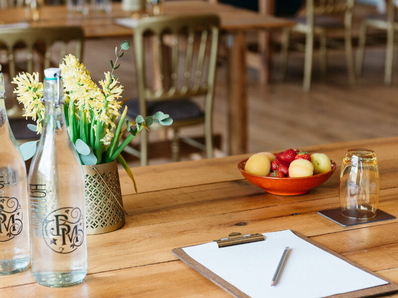 Burley Manor meeting room with natural light, wooden beams, and conference-style seating