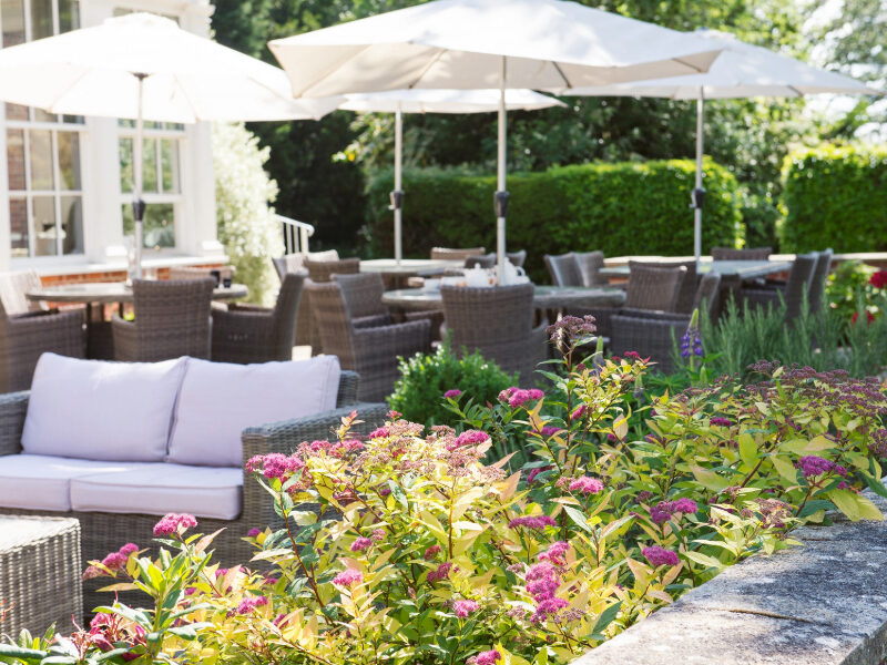 A beautiful outdoor terrace at Bartley Lodge, offering a relaxing space to enjoy a meal or drink while taking in the scenic views of the New Forest. Perfect for unwinding in nature, whether for casual dining or a peaceful afternoon break.