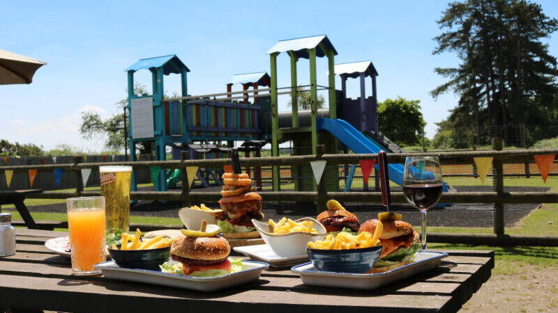 Guests enjoying 25% off midweek lunch at The Drift Inn in the New Forest