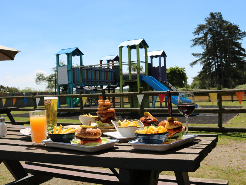 Guests enjoying 25% off midweek lunch at The Drift Inn in the New Forest