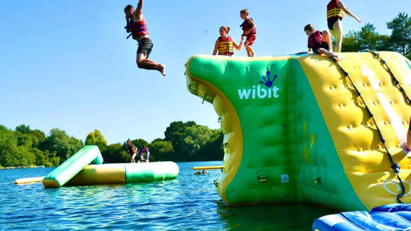New Forest Water Park, an exciting outdoor adventure destination offering a variety of water-based activities, including inflatable obstacle courses, kayaking, and paddleboarding, set in the scenic New Forest. Perfect for family fun and adventure seekers.