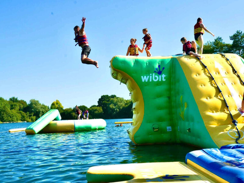 New Forest Water Park, an exciting outdoor adventure destination offering a variety of water-based activities, including inflatable obstacle courses, kayaking, and paddleboarding, set in the scenic New Forest. Perfect for family fun and adventure seekers.